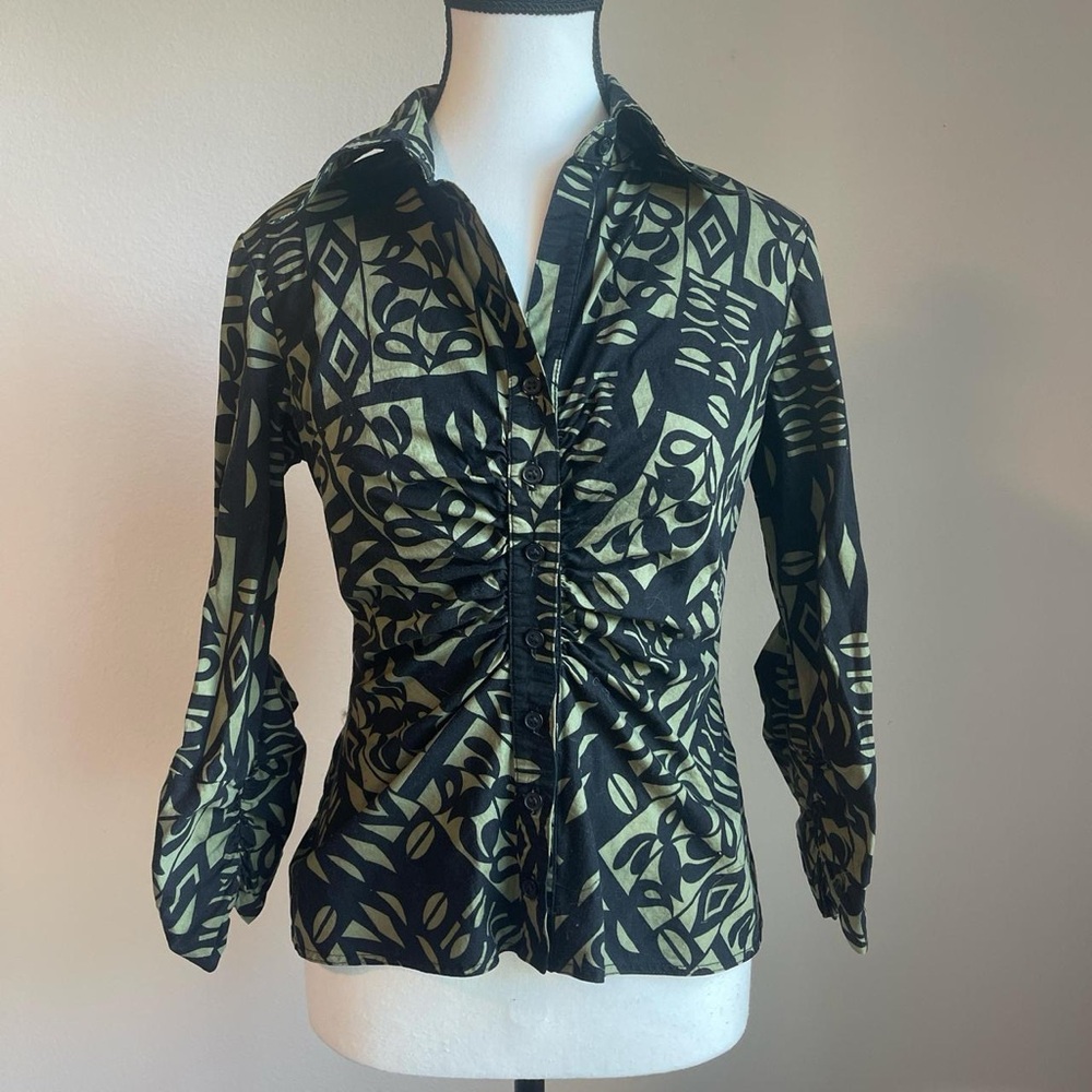 Green and black patterned blouse with a ruched front and 3/4 ruched sleeves